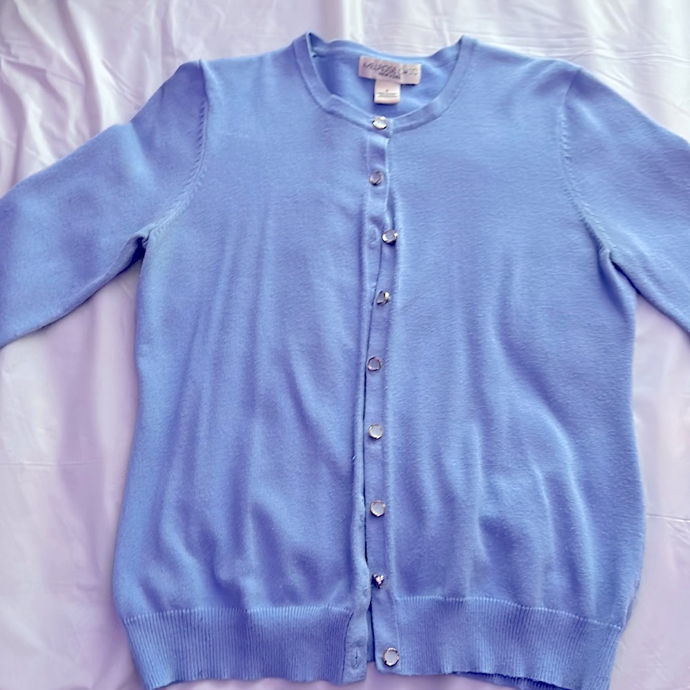 Light baby blue sweater it’s soft and it’s size is a small